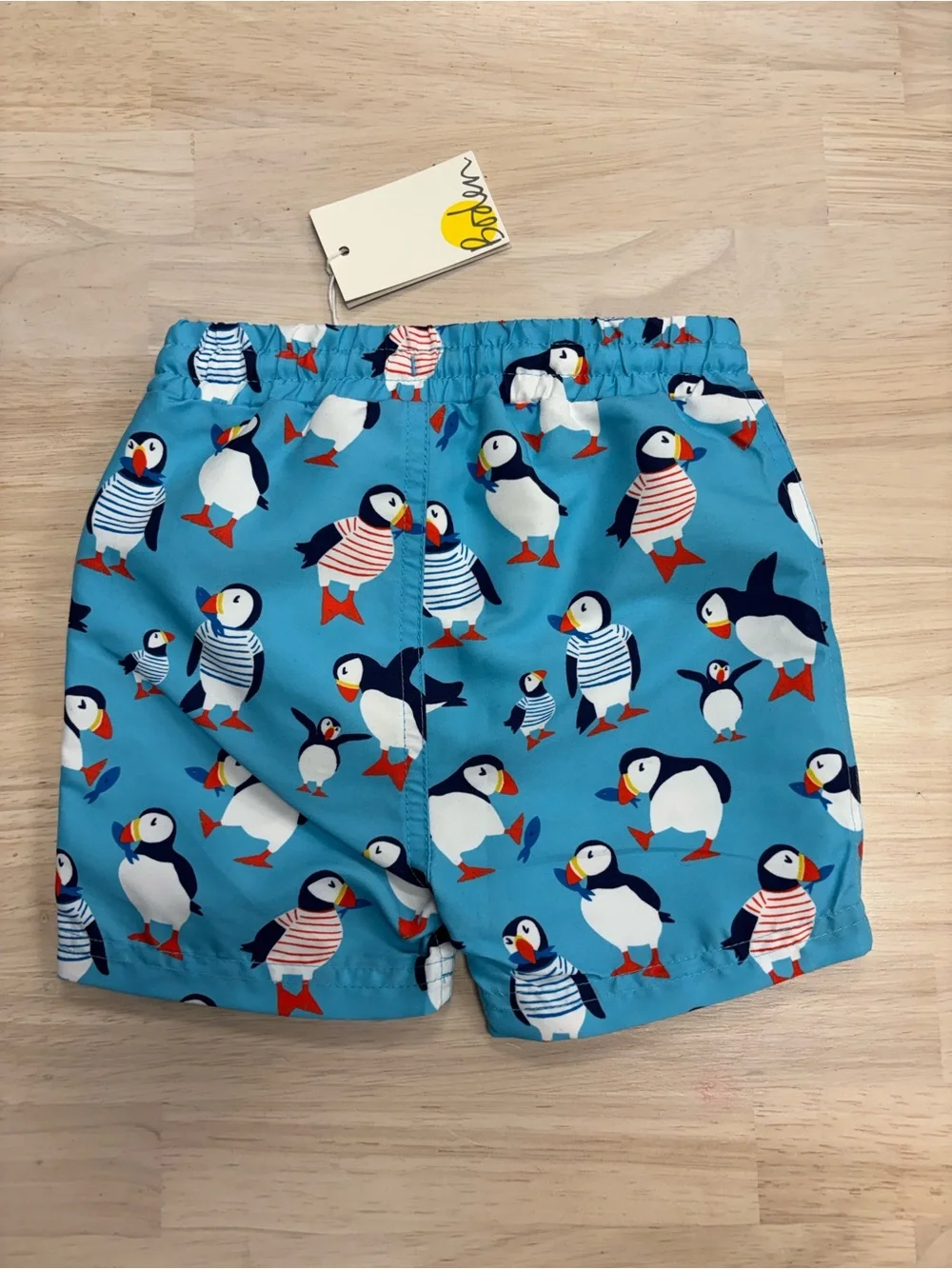 New Baby Boden puffin swim trunks